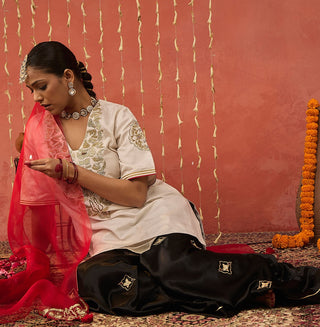 Ivory Roli Silk Embroidered Short Kurta And Sharara Set by Shivani Bhargava available on Indiaspopup.com