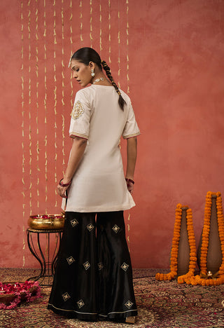 Ivory Roli Silk Embroidered Short Kurta And Sharara Set by Shivani Bhargava available on Indiaspopup.com