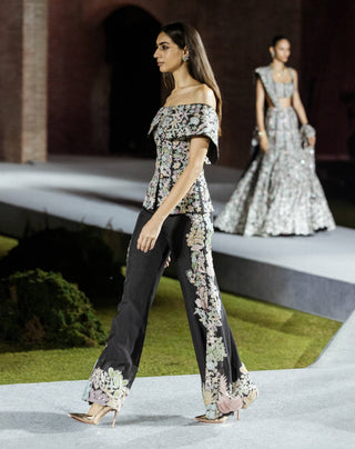 Black tyra pants and off-shoulder top