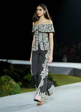 Black tyra pants and off-shoulder top