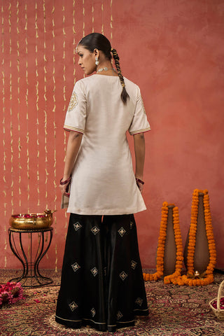 Ivory Roli Silk Embroidered Short Kurta And Sharara Set by Shivani Bhargava available on Indiaspopup.com