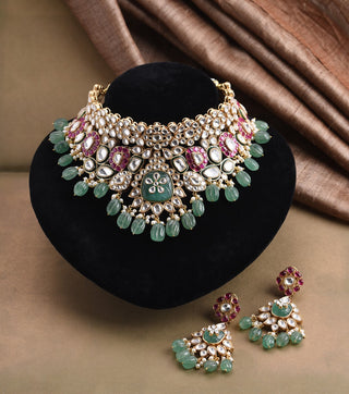 Niharika red and green polki necklace set