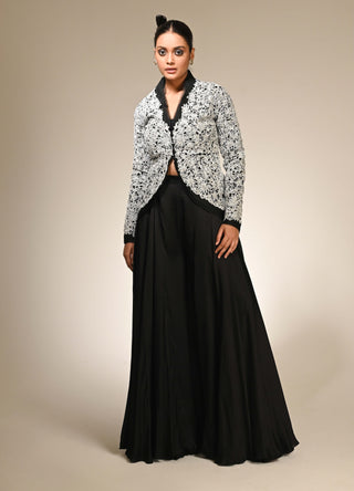 Black floral cutwork jacket and flared pants