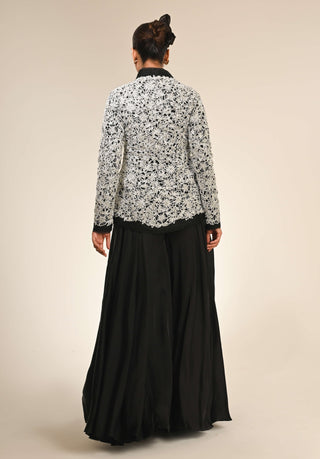 Black floral cutwork jacket and flared pants