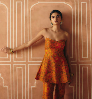 Burnt orange peplum and panelled pants