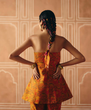 Burnt orange peplum and panelled pants