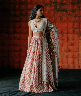 White Embroidered Blouse And Printed Lehenga Set by Drishti & Zahabia available on Indiaspopup.com