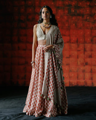 White Embroidered Blouse And Printed Lehenga Set by Drishti & Zahabia available on Indiaspopup.com