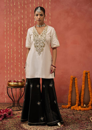 Ivory Roli Silk Embroidered Short Kurta And Sharara Set by Shivani Bhargava available on Indiaspopup.com