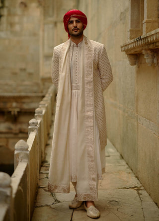 Cream sherwani jacket with choga and churidar set