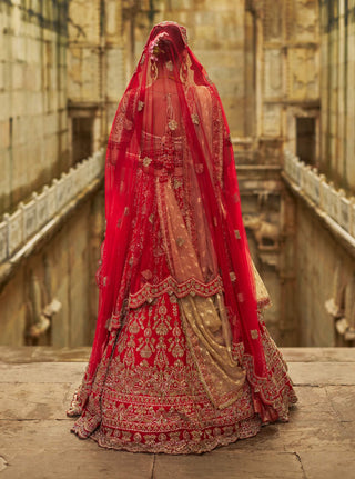 Red raw silk lehenga and gold choli set