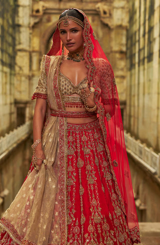 Red raw silk lehenga and gold choli set