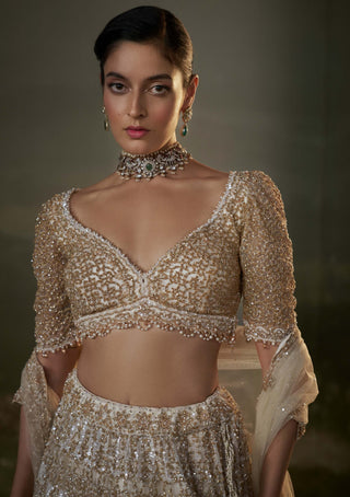 Nitika Gujral Ivory And Gold Lehenga Choli Set available on indiaspopup