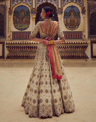Gold Bridal Lehenga Choli Set by Nitika Gujral available on Indiaspopup.com
