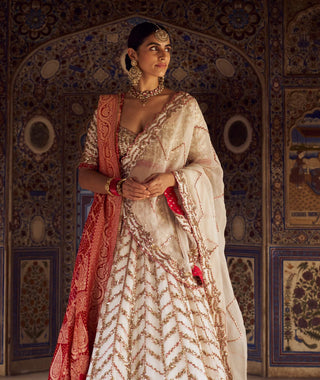Ivory Organza Lehenga Choli Set by Nitika Gujral available on Indiaspopup.com