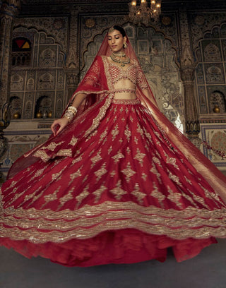 Deep Red Raw Silk Lehenga Choli Set by Nitika Gujral available on Indiaspopup.com