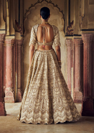 Gold Raw Silk Lehenga Choli Set by Nitika Gujral available on Indiaspopup.com