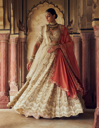 Gold Raw Silk Lehenga Choli Set by Nitika Gujral available on Indiaspopup.com