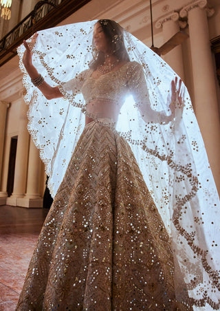 Cream Gold Highlight Lehenga Set by Tamanna Punjabi Kapoor available on Indiaspopup.com