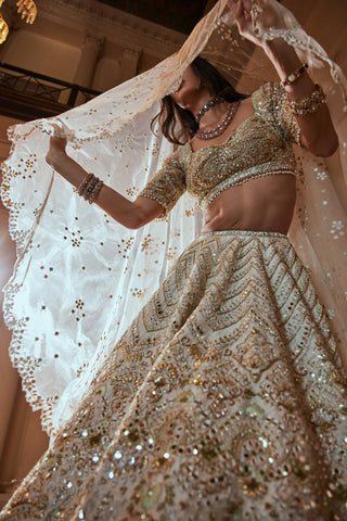 Cream Gold Highlight Lehenga Set by Tamanna Punjabi Kapoor available on Indiaspopup.com