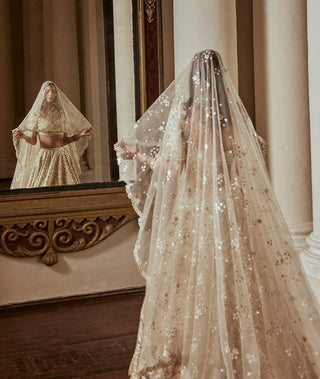 Cream Gold Highlight Lehenga Set by Tamanna Punjabi Kapoor available on Indiaspopup.com