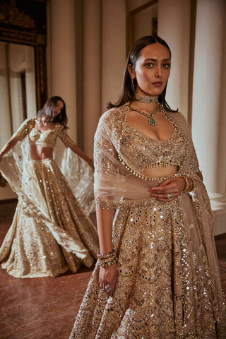 Dusky Rose Mirror Lehenga Set by Tamanna Punjabi Kapoor available on Indiaspopup.com