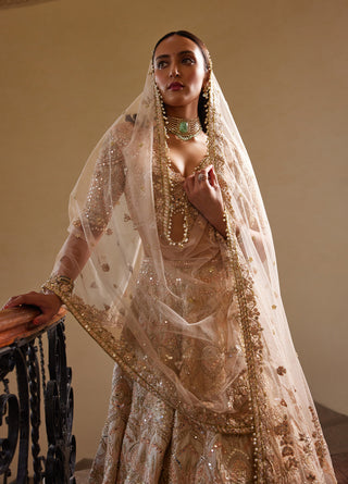 Peach Self Embroidered Mirror Lehenga Set by Tamanna Punjabi Kapoor available on Indiaspopup.com