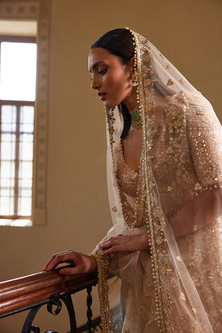 Peach Self Embroidered Mirror Lehenga Set by Tamanna Punjabi Kapoor available on Indiaspopup.com