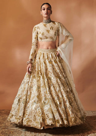 Ivory And Gold Heavily Embroidered Lehenga Set by Tamanna Punjabi Kapoor, available on Indiaspopup.com