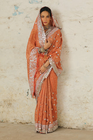 Copper Rust Sari And Unstitched Blouse by Saksham & Neharicka available on Indiaspopup.com