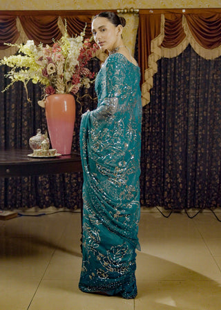 Moonray Teal Embroidered Sari And Blouse by Saksham & Neharicka available on Indiaspopup