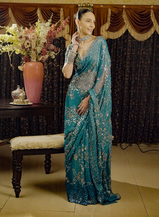 Moonray Teal Embroidered Sari And Blouse by Saksham & Neharicka available on Indiaspopup