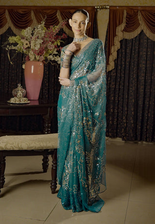 Moonray Teal Embroidered Sari And Blouse by Saksham & Neharicka available on Indiaspopup