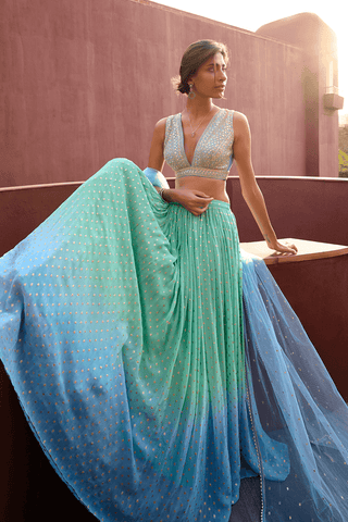 Emma Blue And Sea Green Lehenga Set by Chamee And Palak, available on Indiaspopup.com