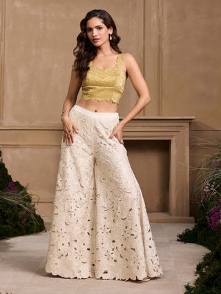 Gold tonal quilted bustier, ivory jacket and pants