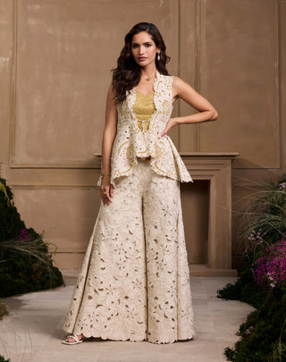 Gold tonal quilted bustier, ivory jacket and pants