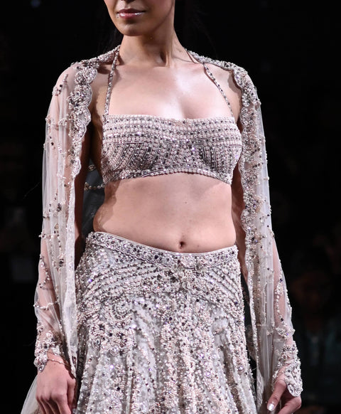 Buy Silver sequin embellished ruffle blouse and lehenga by Masumi Mewawalla  at Aashni and Co