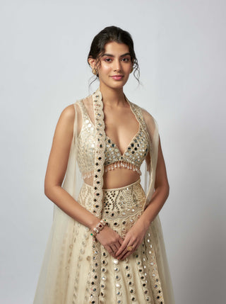 Shravani Ivory Lehenga And Cape Set by Gopi Vaid available on Indiaspopup