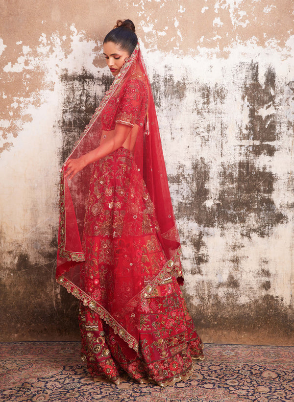 Photo of Bride in heavy patchwork lehenga.