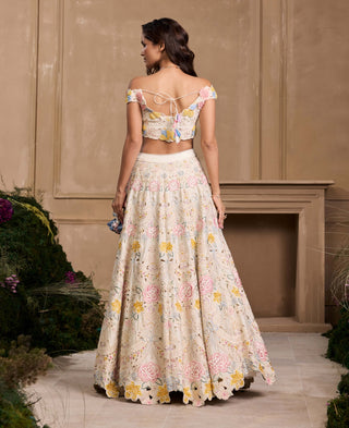 Ivory Pastel 3D Floral Applique Bustier And Lehenga by Chandrima available on Indiaspopup