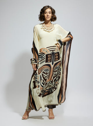 Ivory silk kaftan and brown printed pants