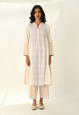Donetzica ivory tunic dress and beige pants