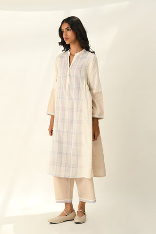 Donetzica ivory tunic dress and beige pants