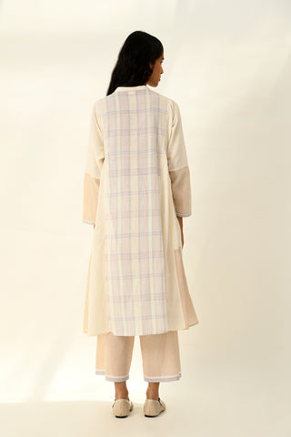 Donetzica ivory tunic dress and beige pants