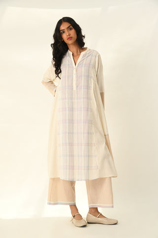 Donetzica ivory tunic dress and beige pants