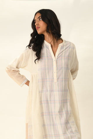 Donetzica ivory tunic dress and beige pants