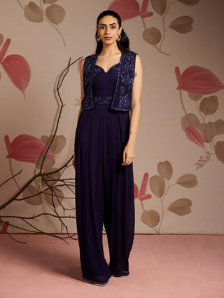 Midnight blue jacket and full-length pleated jumpsuit