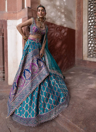 Teal Bandhani Banarasi Lehenga Set by Aditi Gupta available on Indiaspopup.com