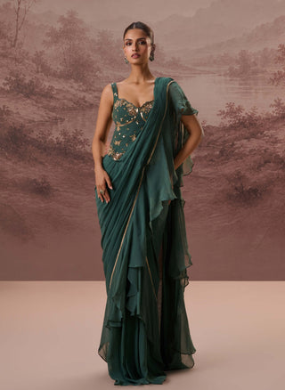 Green harit drape sari and corset blouse
