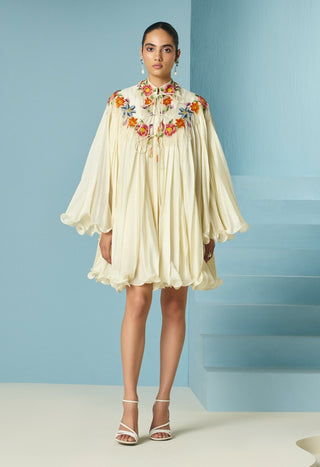 Ivory pleated dress with floral cape